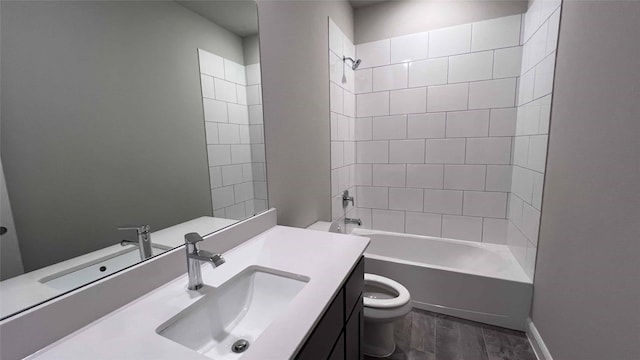 full bathroom featuring hardwood / wood-style flooring, vanity, toilet, and tiled shower / bath combo