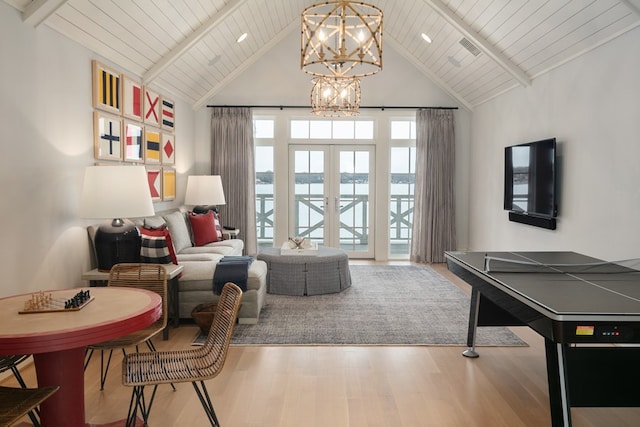 living area with an inviting chandelier, wood ceiling, french doors, and hardwood / wood-style flooring