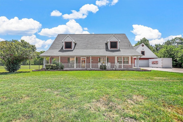 cape cod-style house with a porch, a garage, and a front yard