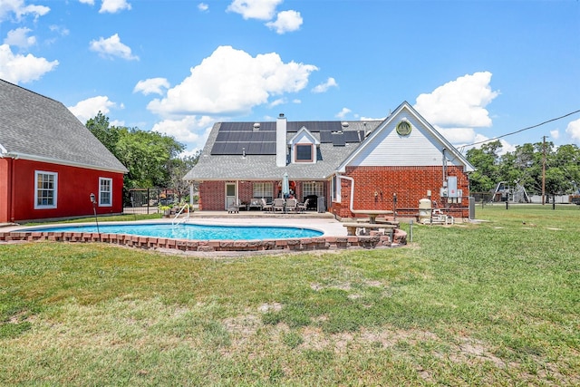 view of pool with a yard and a patio area