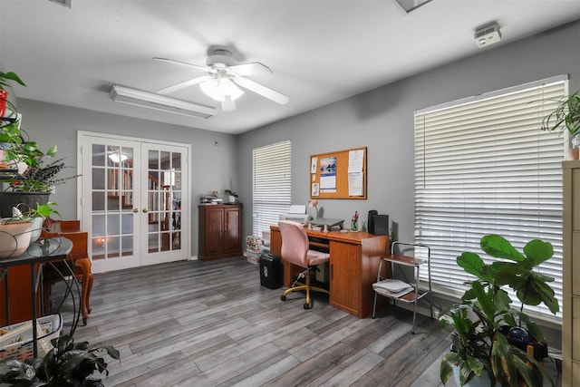 office featuring french doors, ceiling fan, and light wood-type flooring