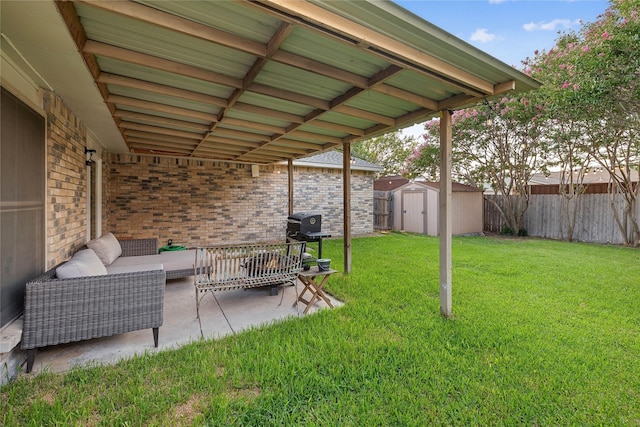 view of yard featuring a patio area, outdoor lounge area, and a storage unit