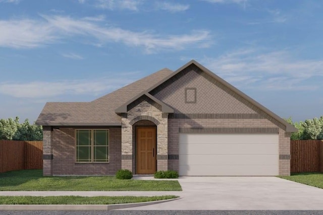 view of front of property with a garage and a front yard