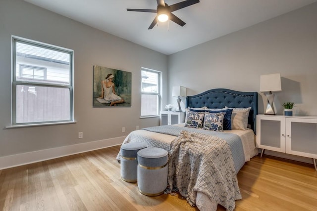 bedroom with ceiling fan and light hardwood / wood-style flooring