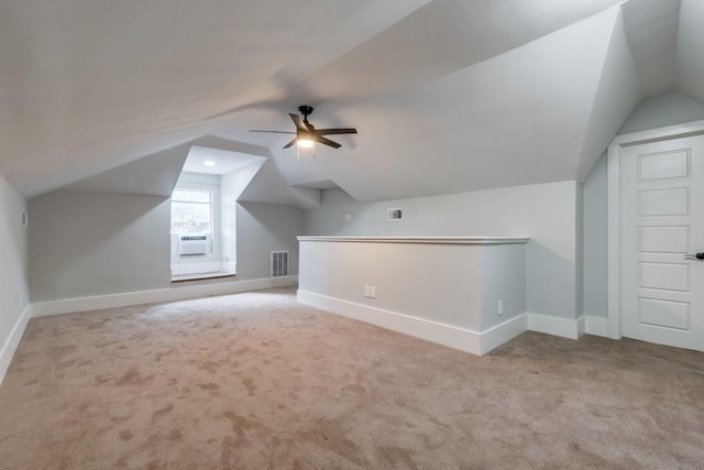 bonus room with ceiling fan, light colored carpet, vaulted ceiling, and cooling unit