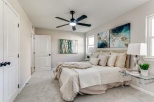 carpeted bedroom with ceiling fan