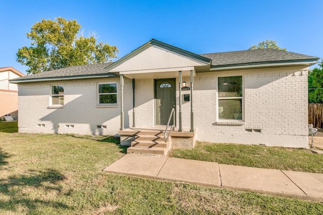 ranch-style home with a front lawn