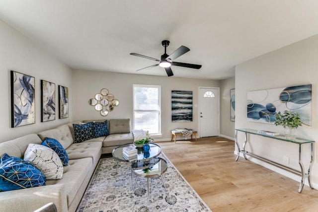 living room featuring hardwood / wood-style flooring and ceiling fan