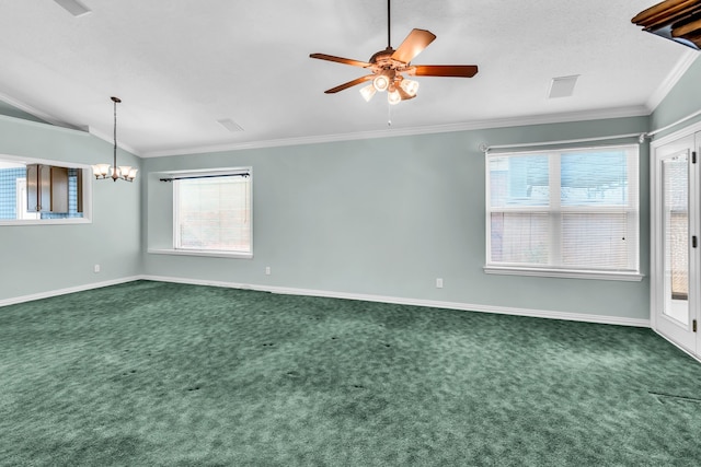 empty room featuring lofted ceiling, crown molding, carpet floors, and plenty of natural light