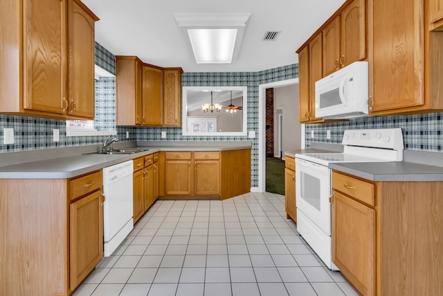 kitchen with decorative light fixtures, sink, light tile patterned floors, a notable chandelier, and white appliances