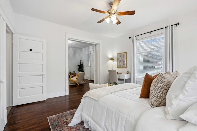 bedroom with dark wood-type flooring and ceiling fan