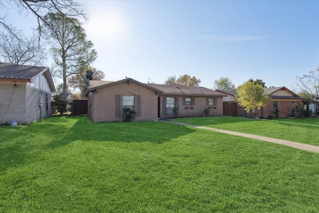 ranch-style home featuring a front yard