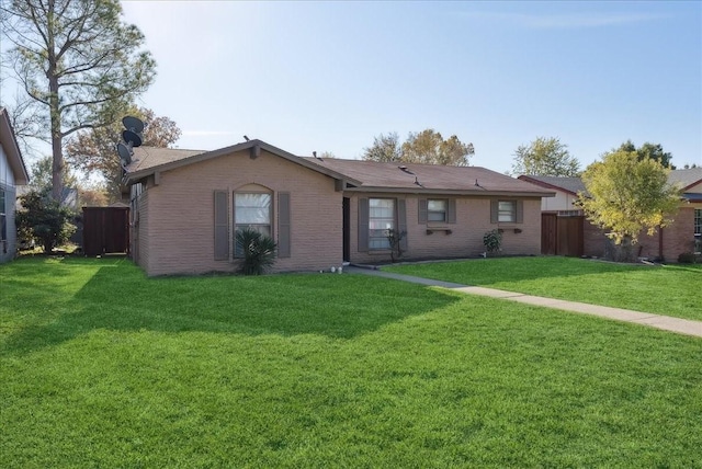 ranch-style house featuring a front yard