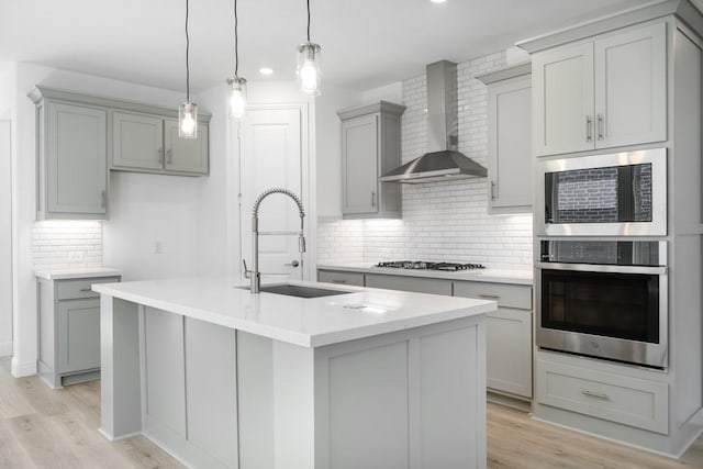 720 Rosemary Rd, Argyle, TX 76226 - kitchen with gas stovetop, gray cabinetry, built in microwave, wall chimney exhaust hood, and stainless steel oven