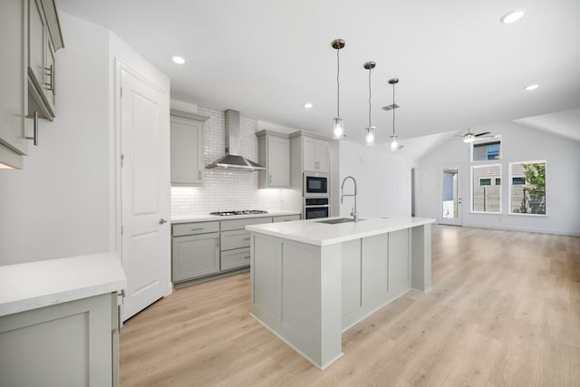 720 Rosemary Rd, Argyle, TX 76226 - kitchen with gray cabinetry, wall chimney exhaust hood, oven, and a sink