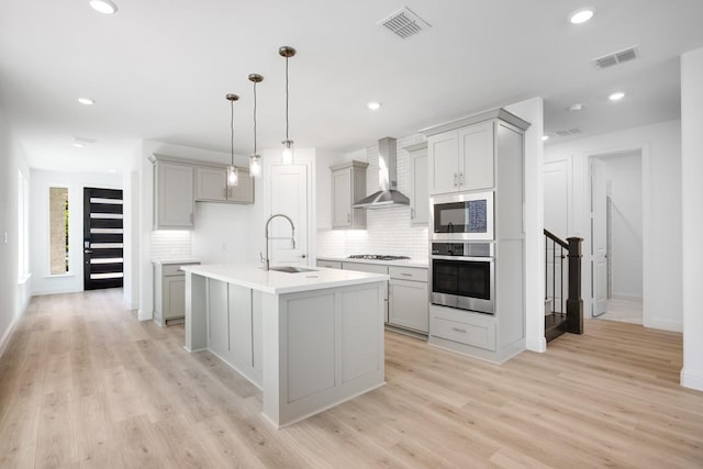 720 Rosemary Rd, Argyle, TX 76226 - kitchen with wall chimney range hood, a sink, visible vents, oven, and white gas cooktop