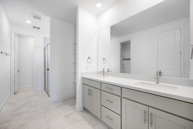 720 Rosemary Rd, Argyle, TX 76226 - bathroom with visible vents, a stall shower, and a sink