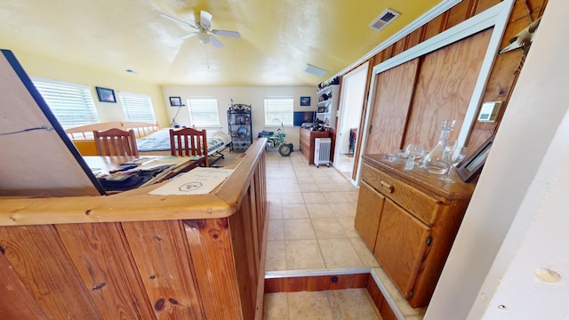 interior space featuring ceiling fan