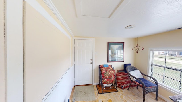 sitting room featuring a textured ceiling