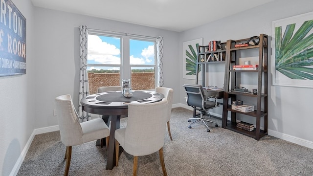 view of carpeted dining area