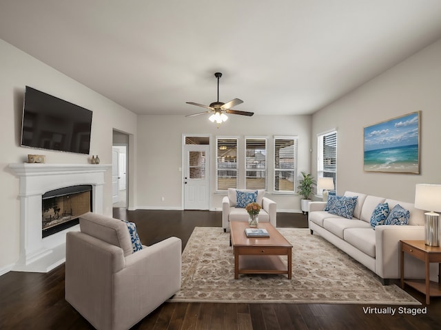 living room with dark hardwood / wood-style floors and ceiling fan