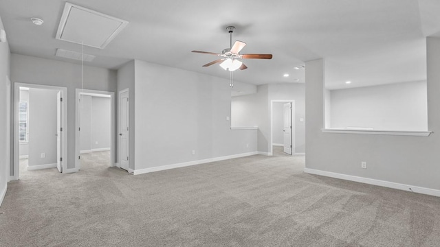 empty room with ceiling fan and light colored carpet