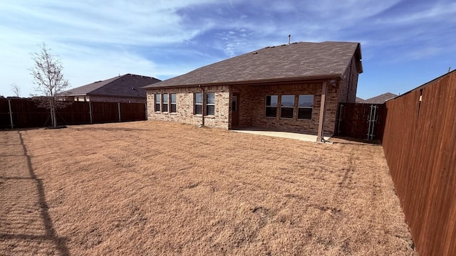 back of house with a patio area