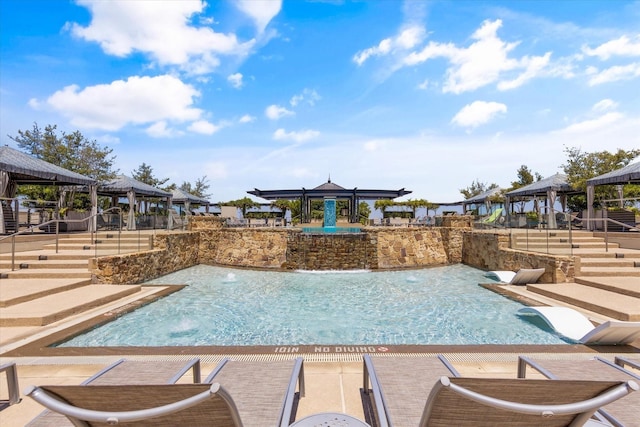 view of pool with a gazebo and pool water feature