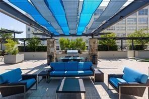 view of patio / terrace featuring outdoor lounge area and a pergola