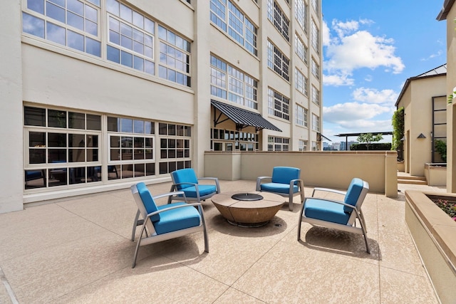 view of patio featuring an outdoor fire pit