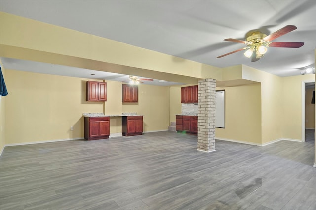 interior space with ceiling fan and light hardwood / wood-style flooring