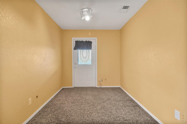 unfurnished room with carpet flooring