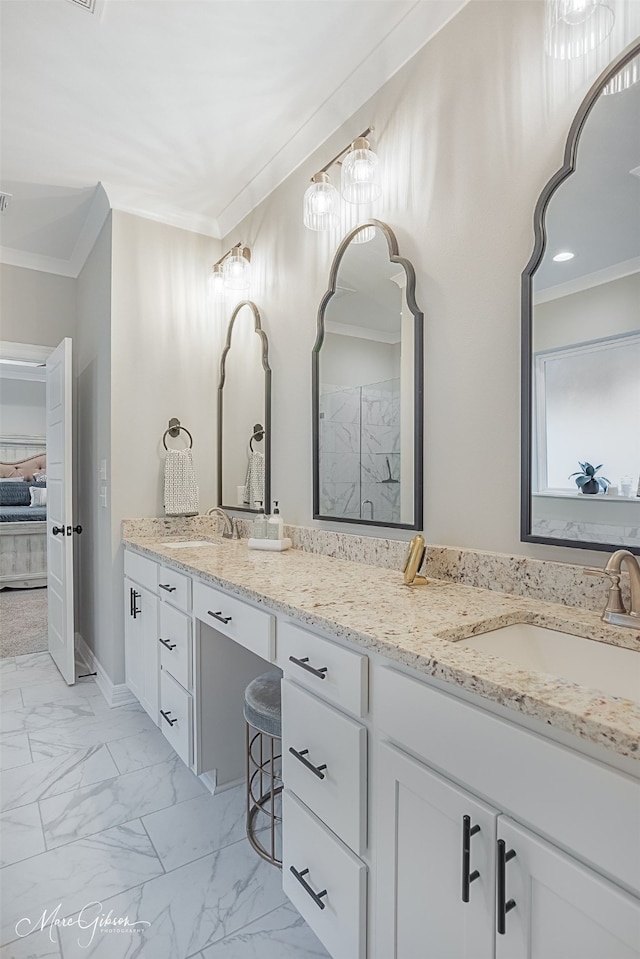 bathroom with crown molding, vanity, and walk in shower