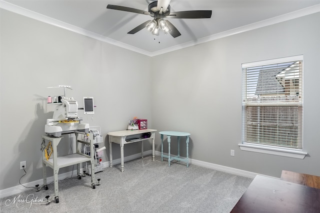 carpeted office space with ceiling fan and ornamental molding