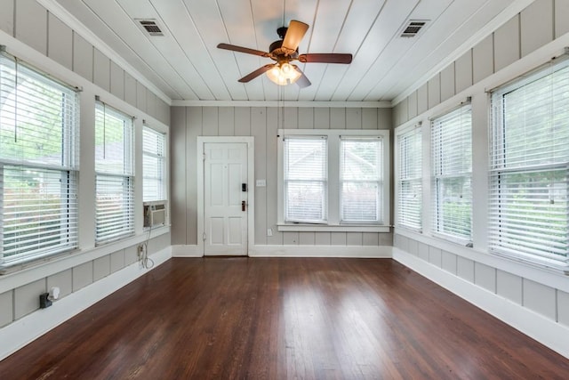 unfurnished sunroom with ceiling fan