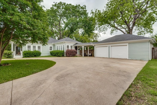 ranch-style home with a garage and a front yard