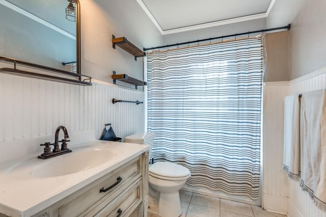 bathroom featuring tile patterned flooring, vanity, toilet, crown molding, and a shower with curtain