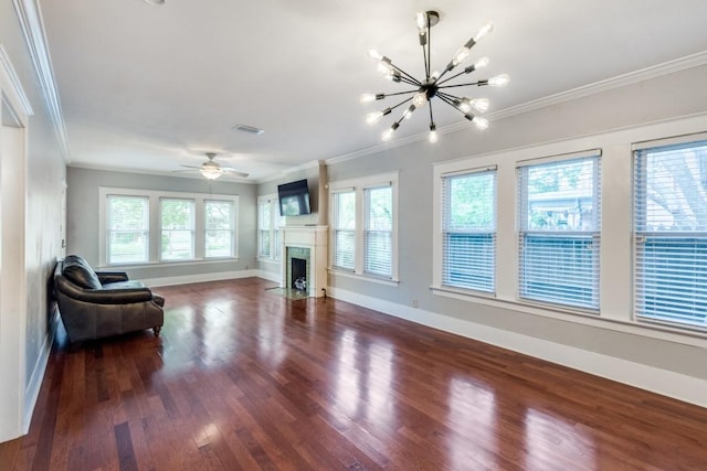 living room featuring crown molding, dark wood-type flooring, and ceiling fan with notable chandelier