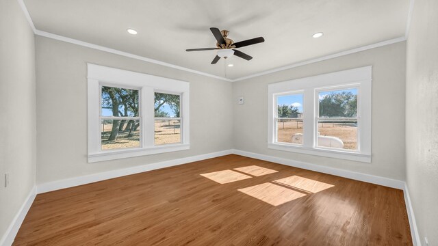 unfurnished room with ornamental molding, wood-type flooring, and ceiling fan