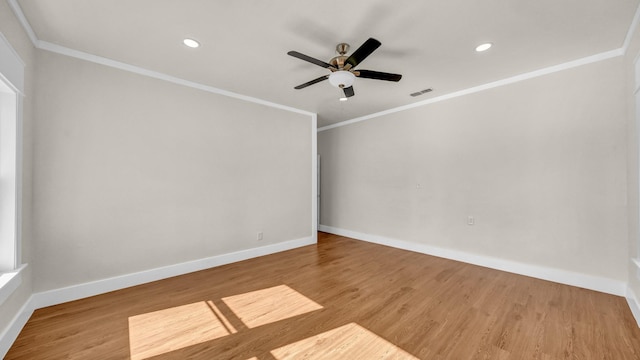 unfurnished room with hardwood / wood-style flooring, crown molding, and ceiling fan