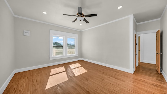 empty room with crown molding, ceiling fan, and light hardwood / wood-style floors