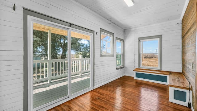 unfurnished sunroom featuring wood ceiling