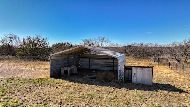 view of outdoor structure with a rural view