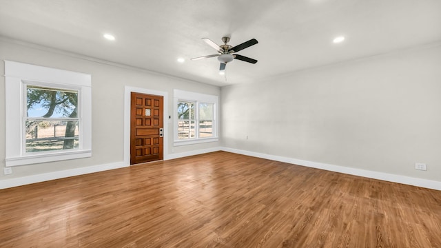 unfurnished living room with hardwood / wood-style floors and ceiling fan