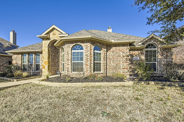 view of front of home with a front yard