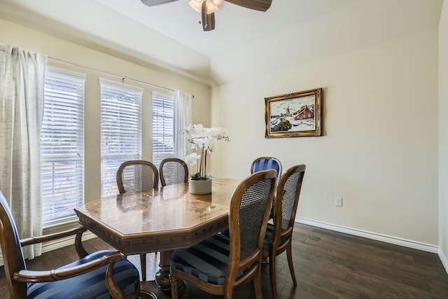 dining room featuring ceiling fan, lofted ceiling, dark hardwood / wood-style floors, and a wealth of natural light