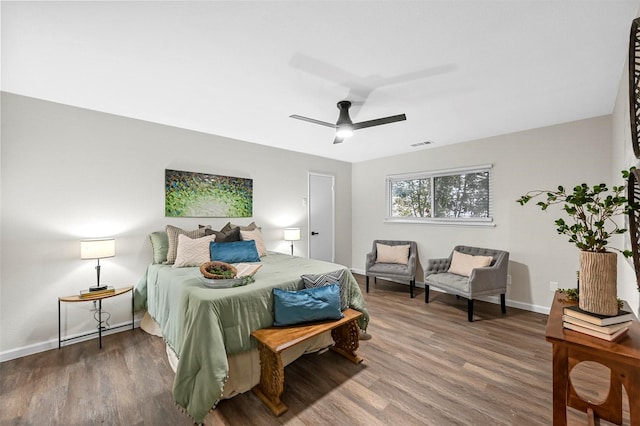 bedroom with hardwood / wood-style flooring and ceiling fan