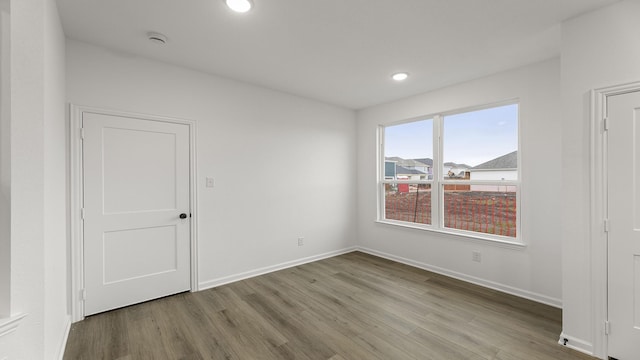 spare room featuring light hardwood / wood-style flooring