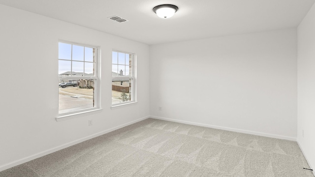 unfurnished room featuring carpet