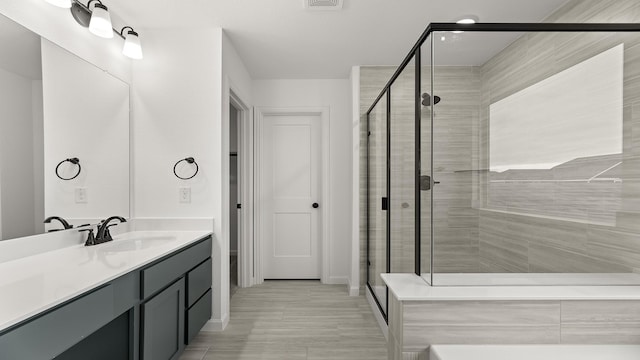 bathroom featuring vanity and walk in shower